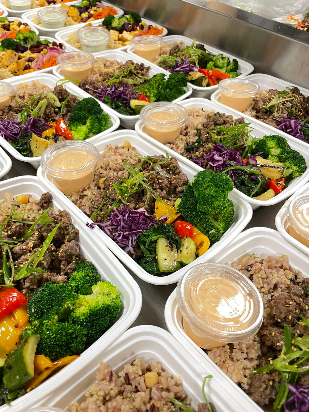 Chef prepared meal prep bowls with high protein, vegetables, and balanced ingredients for clean eating and steady energy